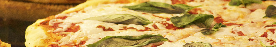Eating Pizza at Omega Pizza restaurant in Wrentham, MA.